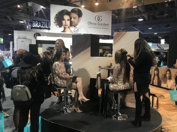 Extensions at a booth at ISSE 2020 showing new extension hair care trends